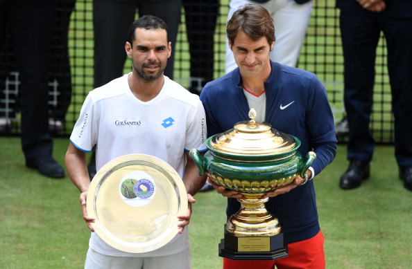 HALLE, GERMANY - JUNE 15: Alejandro Falla of Colombia (L) and Roger Federer of Switzerland pose after the final match against  of the Gerry Weber Open at Gerry Weber Stadium on June 15, 2014 in Halle, Germany.  (Photo by Thomas Starke/Bongarts/Getty Images)