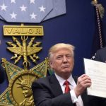 President Trump signs anti-Muslim executve order.