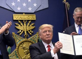President Trump signs anti-Muslim executve order.