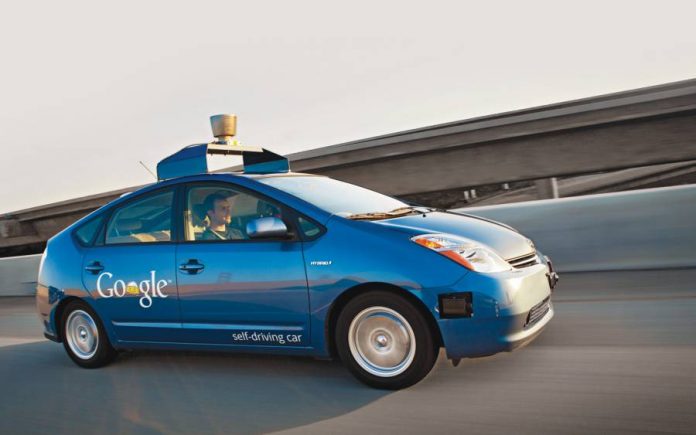 Blue Google autonomous car on the highway
