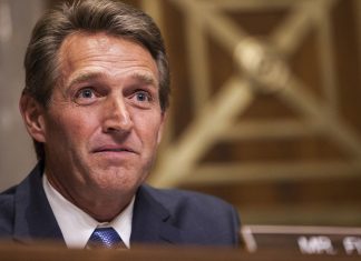Senator Jeff Flake files a resolution on Tuesday to repeal a set of rules approved last October by the FCC