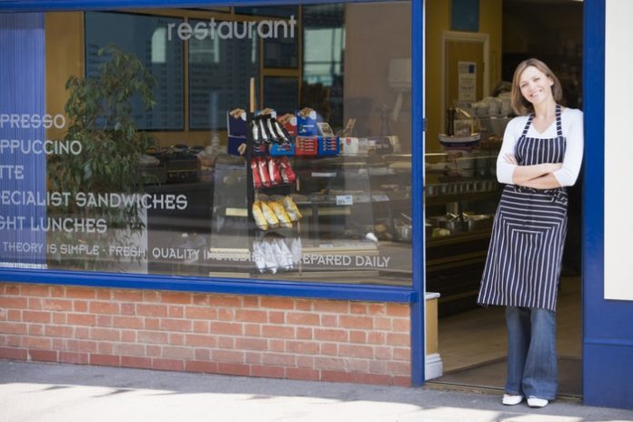 Woman Small Business Owner Standing by the Door